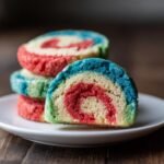 Close-up of Fun And Easy Pinwheel Cookies showing the colorful red, white, and blue swirl pattern.