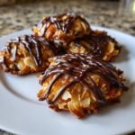 Four Irresistible Florentine Cookies, featuring caramelized almonds and a dark chocolate drizzle, served on a white plate.