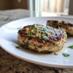 Close-up of a perfectly seared Cilantro Lime Turkey Burger topped with fresh cilantro.